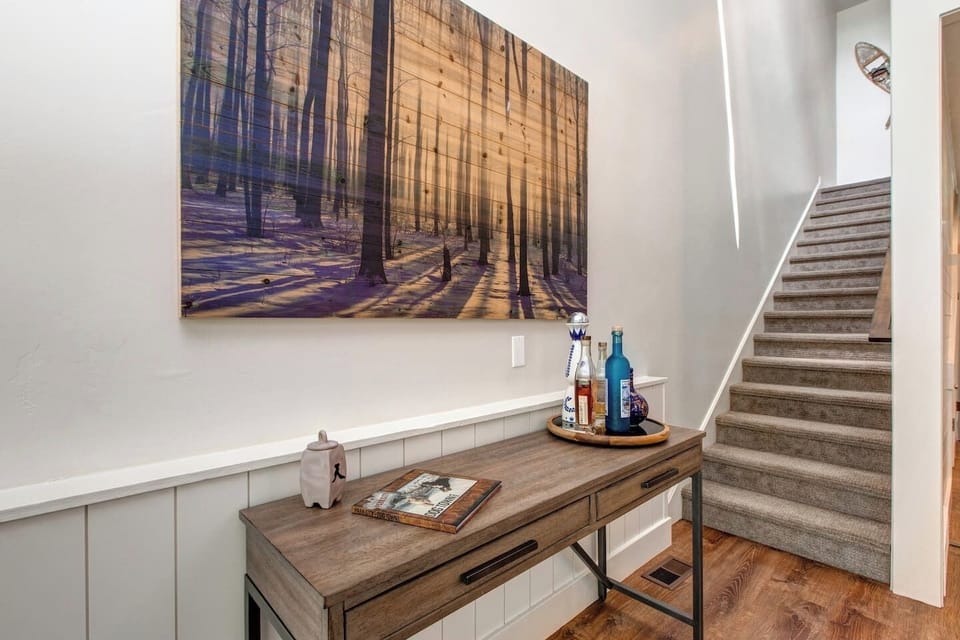Climb the small set of stairs to the king loft room, upstairs bathroom and twin bedroom