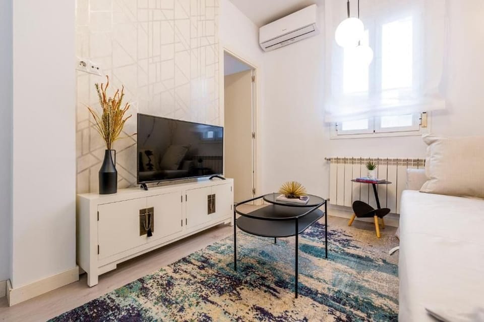 Apartment | Living area | 32-inch flat-screen TV with cable channels