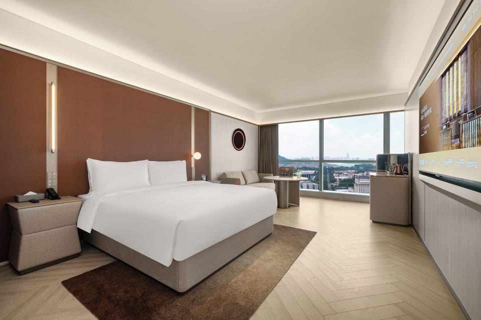 Standard Single Room, Partial Lake View | Down comforters, free minibar, laptop workspace, blackout drapes