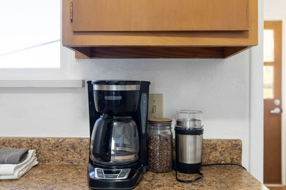 Convenient coffee nook stocked with essentials to help you start your mornings with ease.