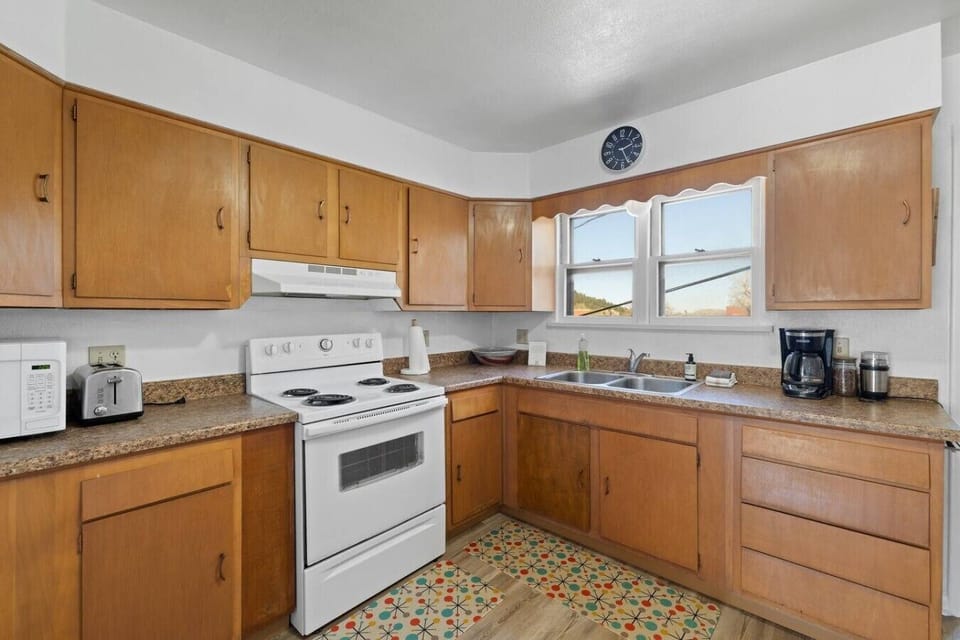Fully equipped with stove, oven, microwave, and refrigerator to support easy home cooking.