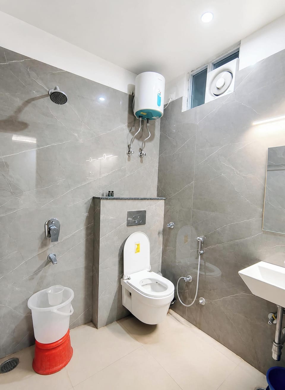 Shower, rainfall showerhead, slippers, towels