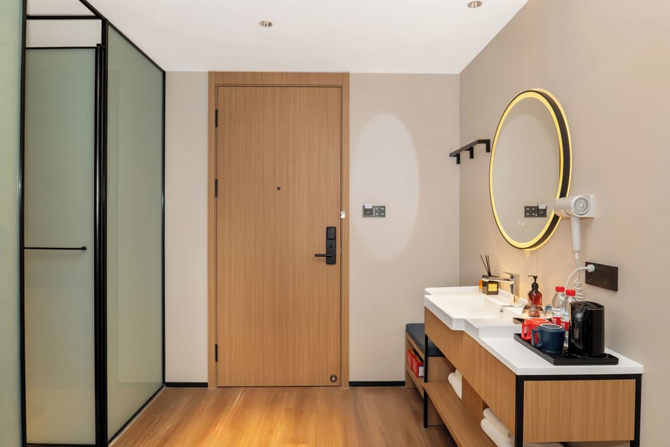 Family Triple Room, Courtyard View | Bathroom | Shower, hair dryer, slippers, towels