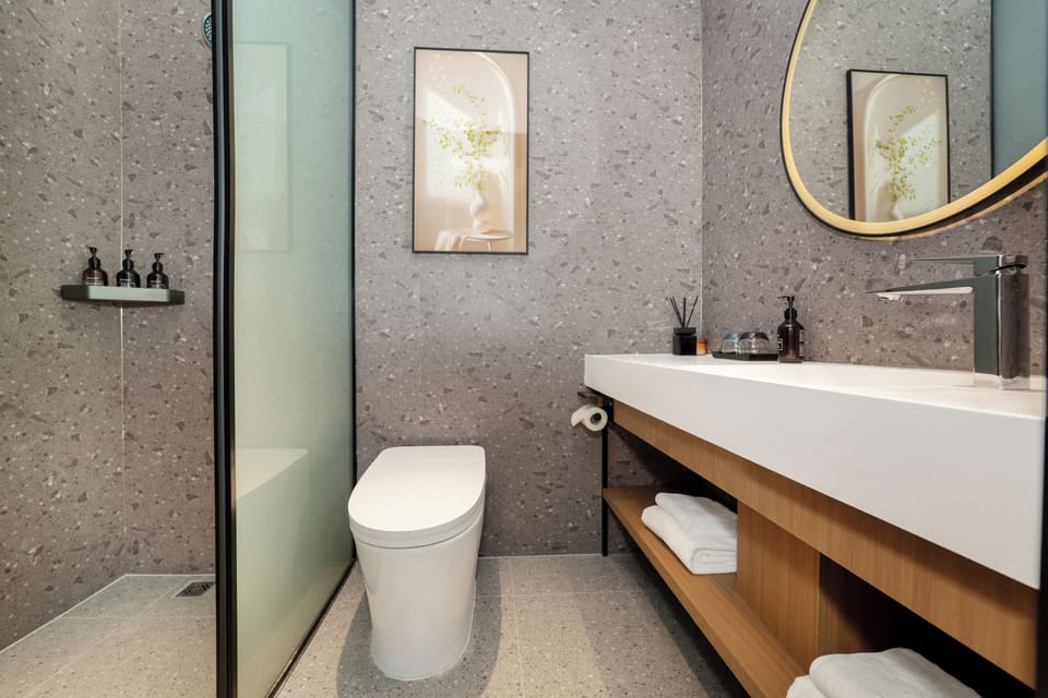 Superior Double Room, Courtyard View | Bathroom | Shower, hair dryer, slippers, towels