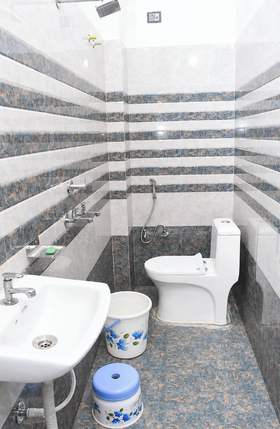 Shower, rainfall showerhead, slippers, towels