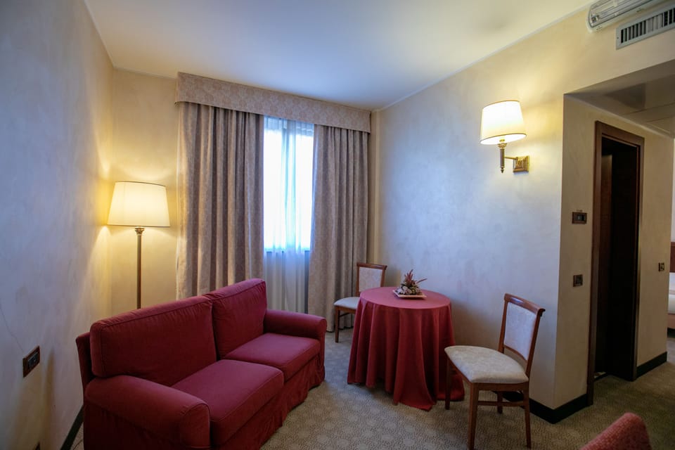 Deluxe Double or Twin Room | Living area | Flat-screen TV