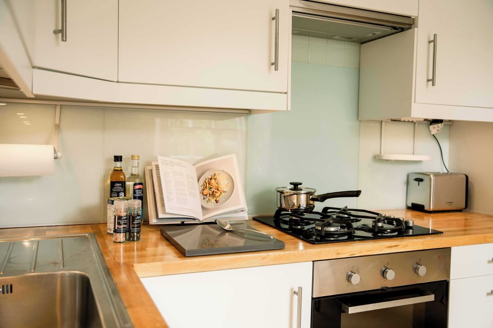 Compact kitchen w/ modern appliances & everything needed for easy home cooking
