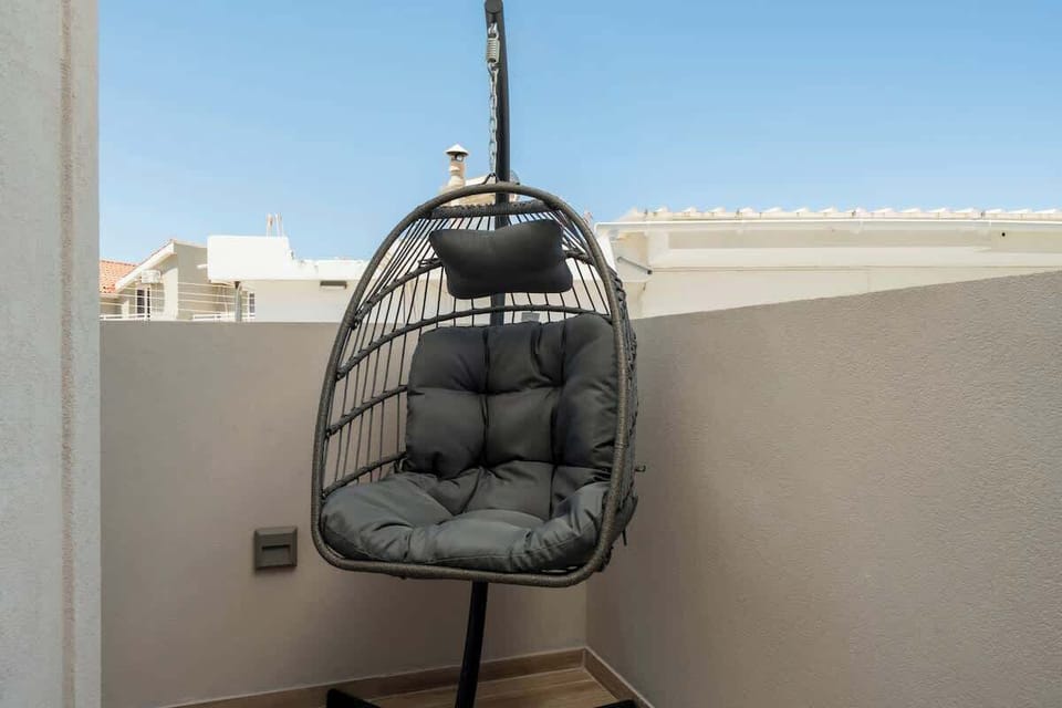 Balcony seating area with open views and peaceful atmosphere