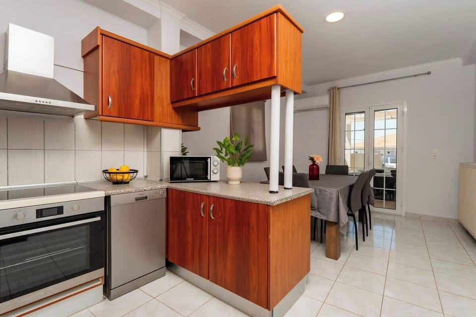 Spacious kitchen and dining area with modern appliances