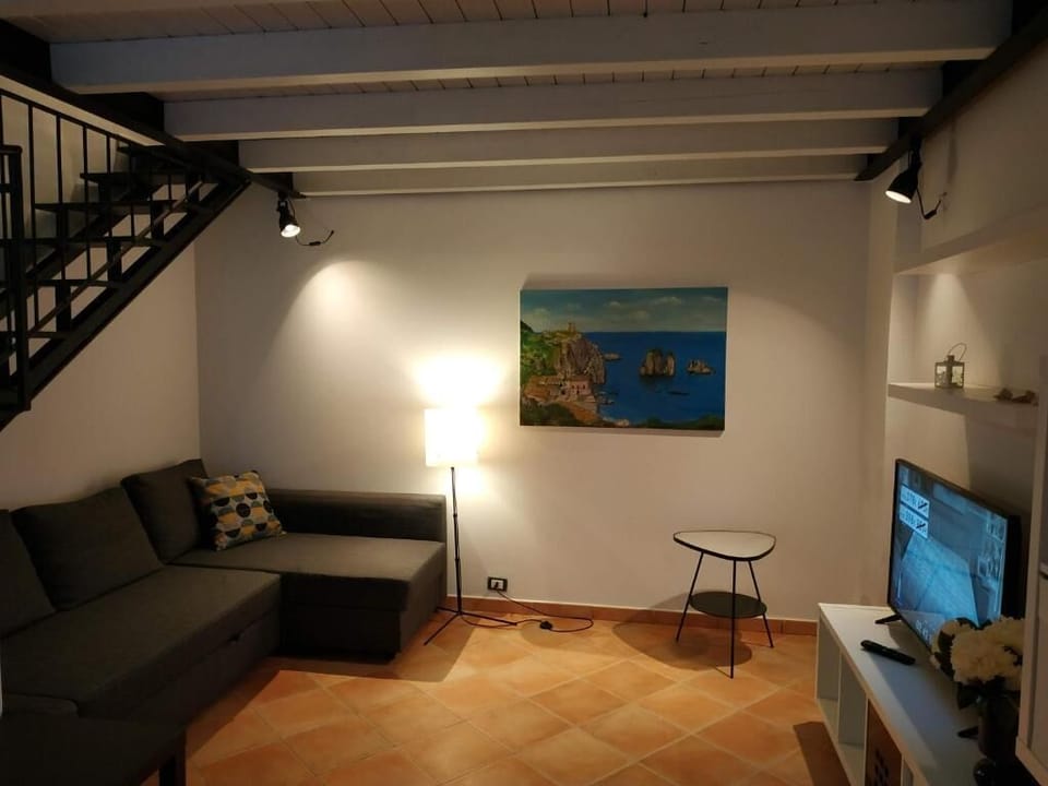 Family Apartment, Partial Sea View | Living area | TV