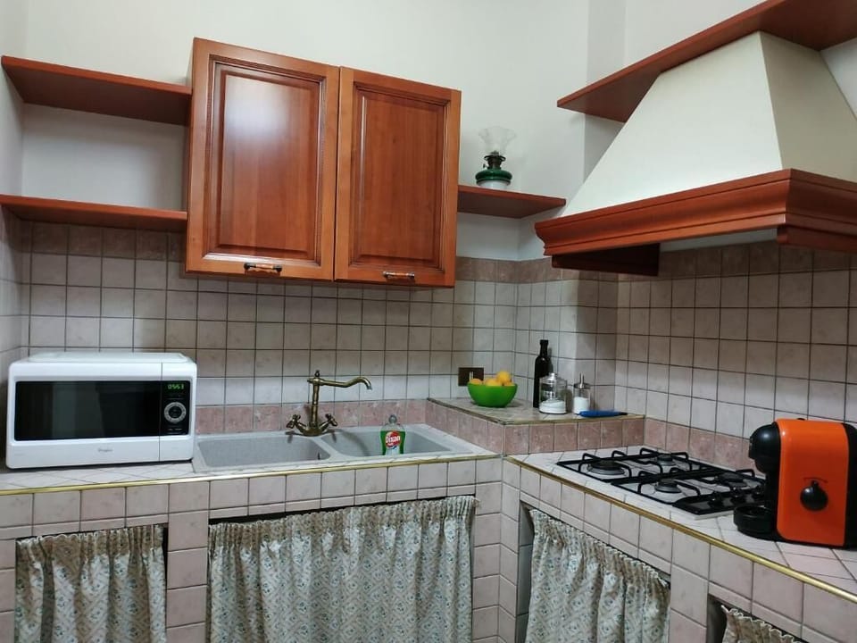 Family Apartment, Partial Sea View | Private kitchen | Fridge, shared microwave
