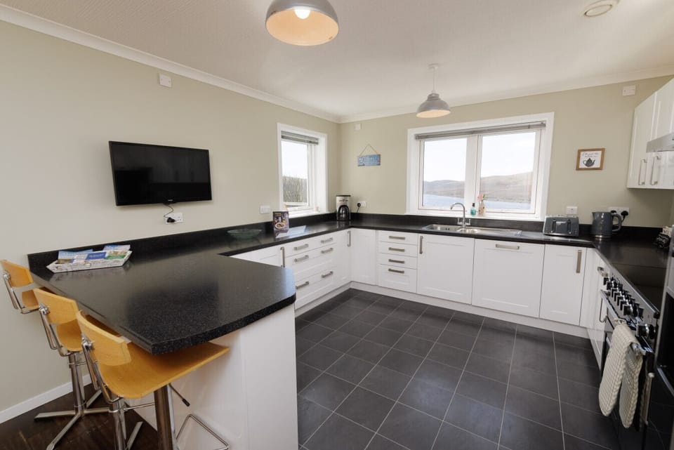 Spacious kitchen with breakfast bar seating