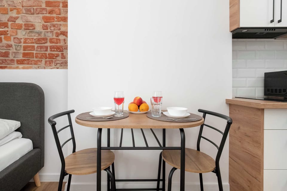 A small dining corner with a table and chairs. It is perfect for meals or working comfortably.