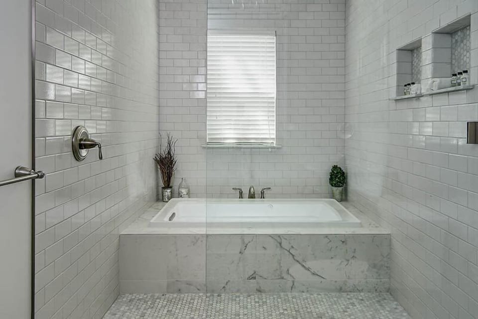 Shower, designer toiletries, towels