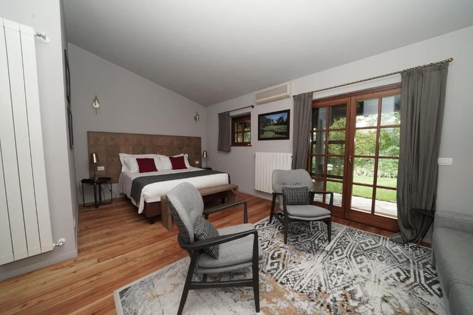 Superior Double Room, Patio, Garden View | In-room safe, desk, laptop workspace, blackout drapes