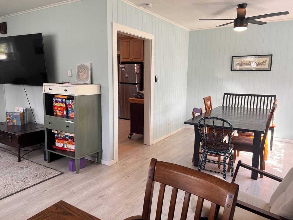 Your cozy retreat features a lofted bedroom, full kitchen with modern appliances, and warm wood accents—a perfect blend of rustic charm and contemporary comfort for your stay.