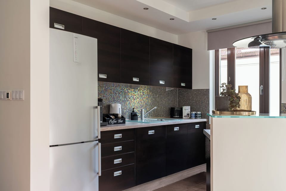 Family Apartment, Non Smoking, Private Bathroom | Private kitchen | Coffee/tea maker, electric kettle, highchair, paper towels