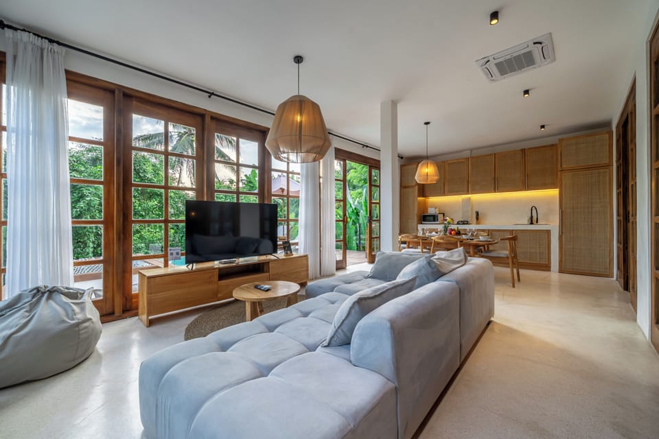 Panoramic Villa, Pool View | Living area | 50-inch Smart TV with digital channels