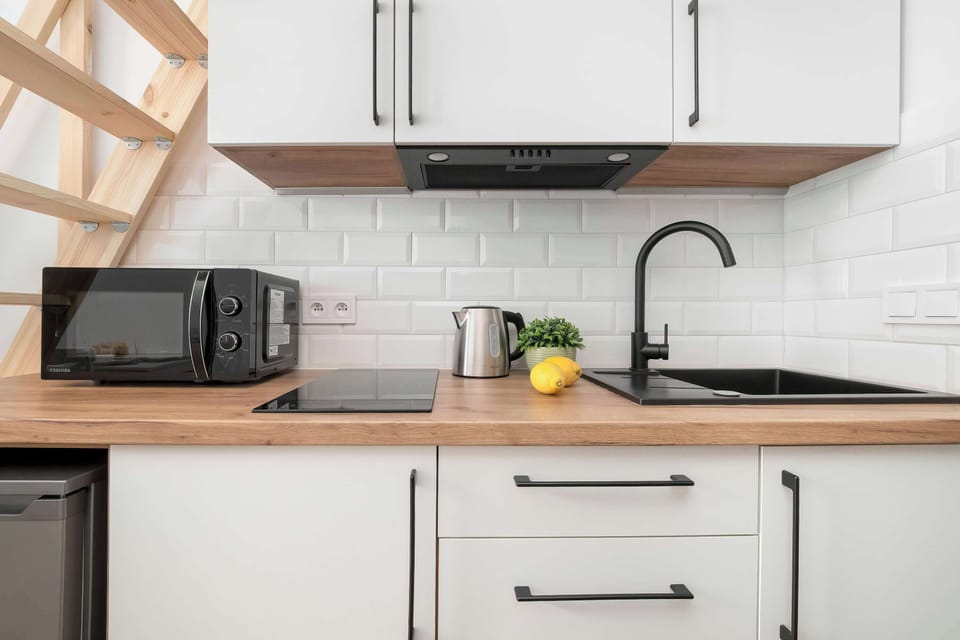 The fully equipped kitchenette includes everything you need for a home-cooked meal.