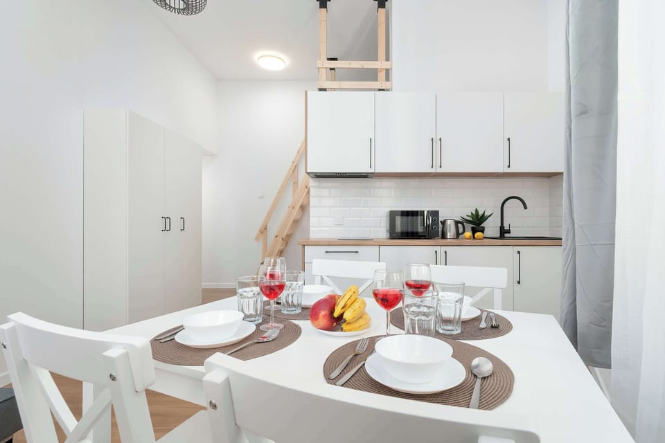The kitchenette's modern design fits perfectly with the living area.