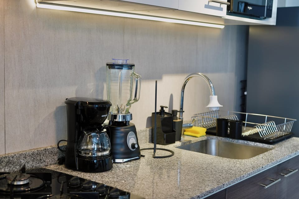 Business Suite, City View | Private kitchen | Full-size fridge, microwave, stovetop, cookware/dishes/utensils