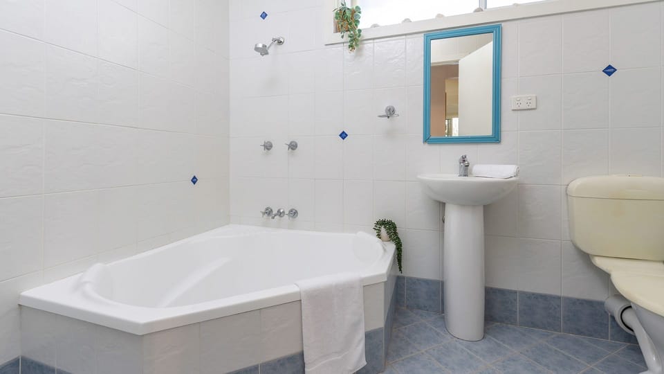 Corner bath rub & shower U/Stairs