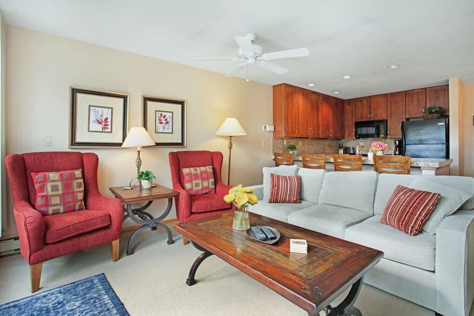 Spacious, sun drenched living room with smart TV and fireplace