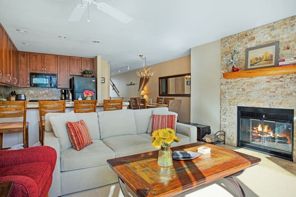 Spacious, sun drenched living room with smart TV and fireplace