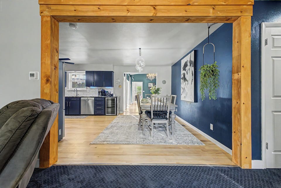 Spacious open flow connecting the first living area to the kitchen.