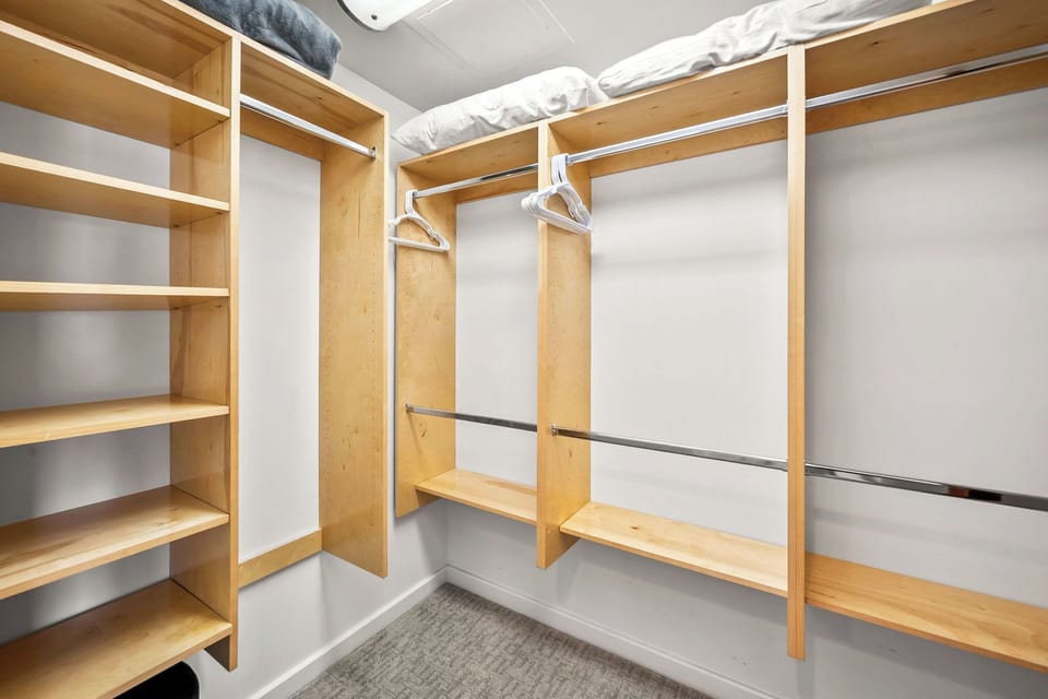 Generous closet space with shelving and hanging rods keeps your belongings organized throughout your stay, with room for everyone in your group.