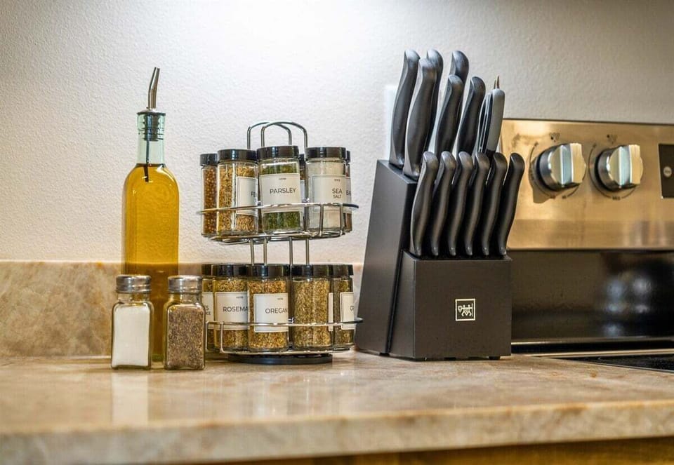 Oil, spices, and quality knives—this kitchen's set up for serious cooks and casual grazers alike.