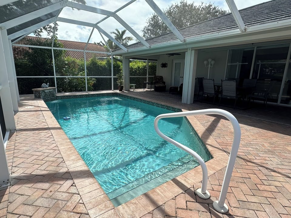 Enjoy the comforts of a south facing private heated pool and screened-in lanai.