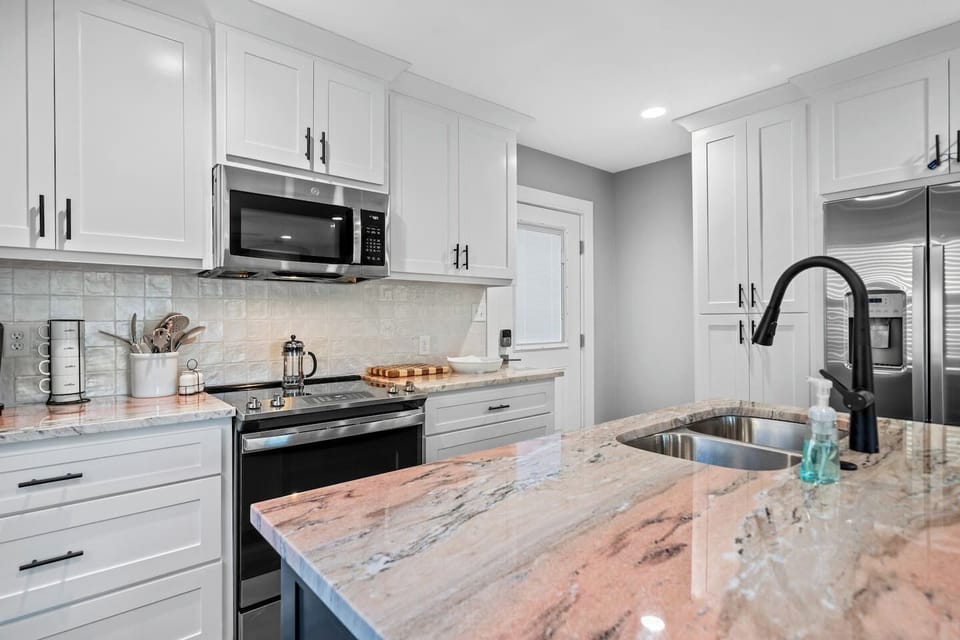 Enjoy Full Size Appliances and Flamingo Pink Granite Countertops!  Everything is Brand New! 