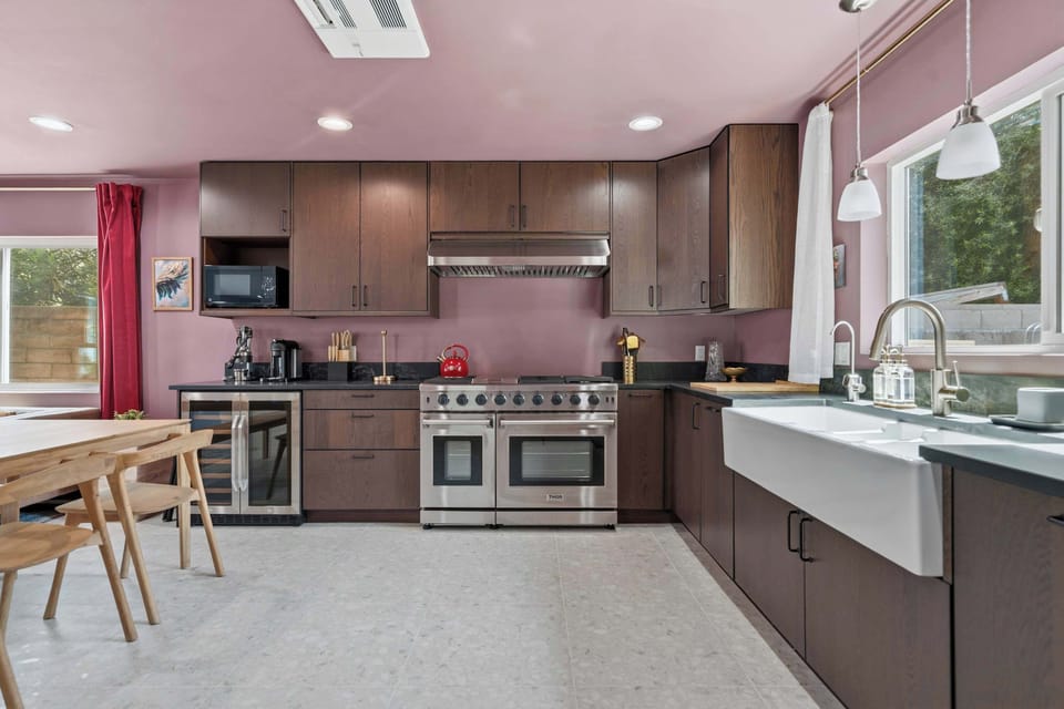 Kitchen — Wide View with Thor Range, Farmhouse Sink, Wine Fridge & Wood Dining Table
