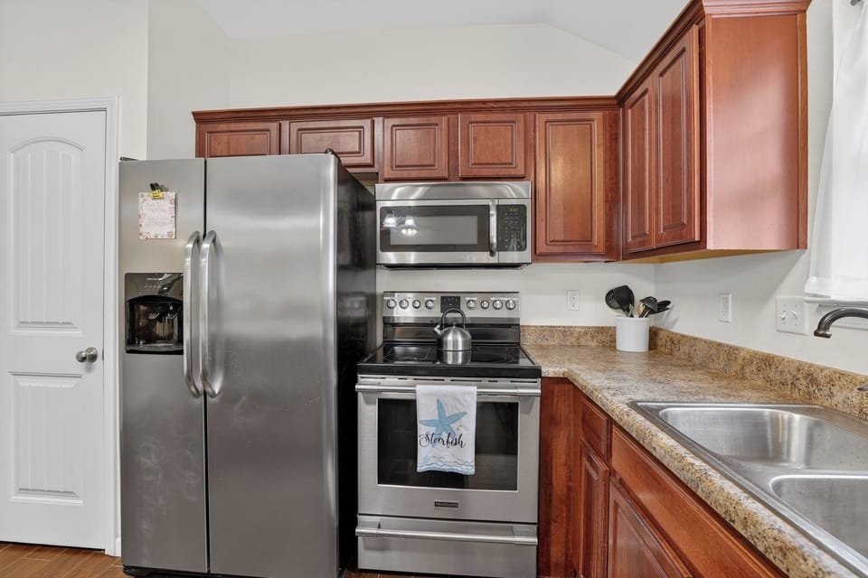 Enjoy our fully-stocked kitchen and new refrigerator!