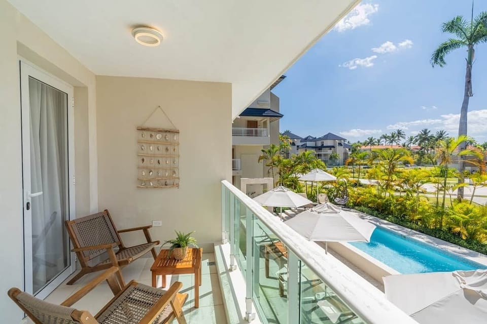 Step onto this charming balcony, your private oasis for relaxation. Surrounded by vibrant plants, it provides a peaceful atmosphere for enjoying morning coffee or evening chats, making it a perfect addition to your beach retreat experience.