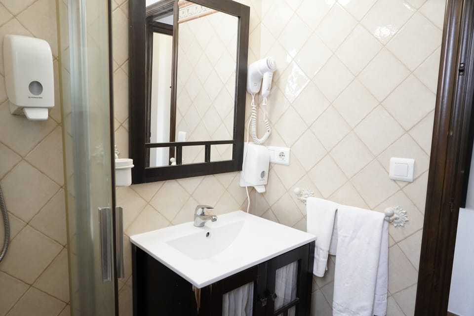 Designer toiletries, hair dryer, towels, soap