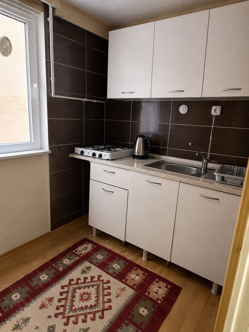 Family Room, City View | Private kitchen | Full-size fridge, stovetop, cookware/dishes/utensils, cleaning supplies