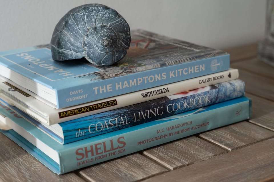 Close-up of the entrance table in this Pine Knoll Shores condo, offering a convenient drop zone for keys, bags, and beach essentials. A simple, functional space that makes coming and going easy during your stay.