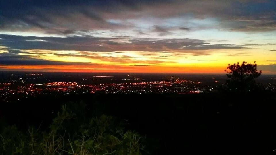 The 360-degree views from Neal Ranch reach their peak at sunset, with the full Colorado Springs city grid and mountain silhouette stretching to the horizon in a panorama that stops conversation mid-sentence.