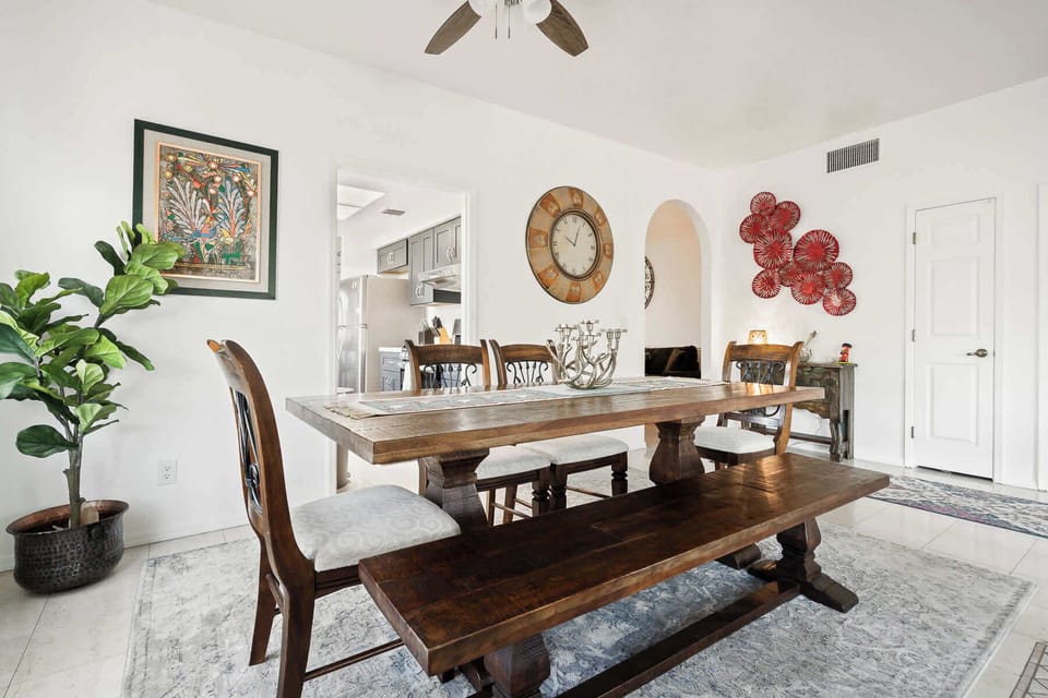 Breakfast nook with seating for four, ideal for morning coffee or casual meals.