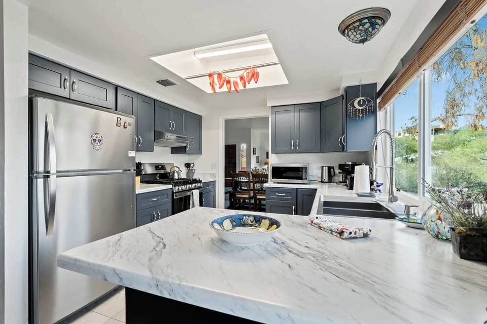 Fully equipped kitchen with modern appliances, ample counter space, and everything you need to cook at home.