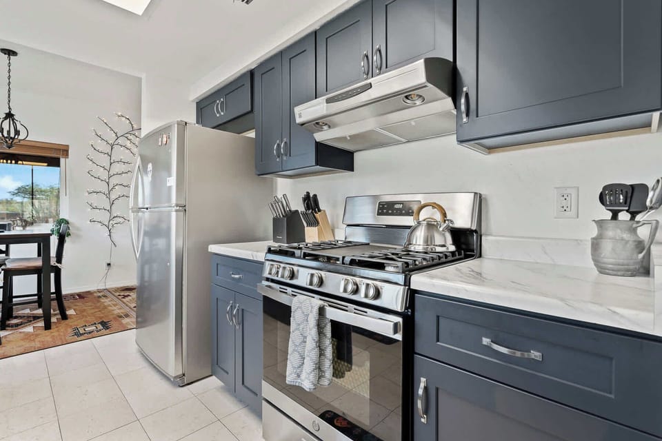 Fully equipped kitchen with stainless steel appliances, gas range, and plenty of prep space.