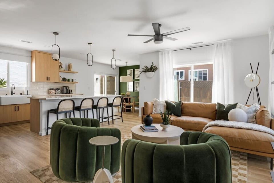 Enjoy an expansive open floor plan that effortlessly connects the stylish living area to a fully equipped modern kitchen and breakfast bar.