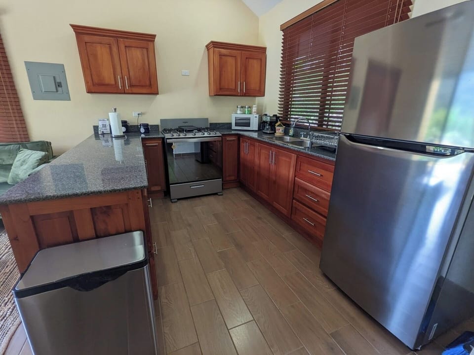 Full size kitchen with modern appliances.  