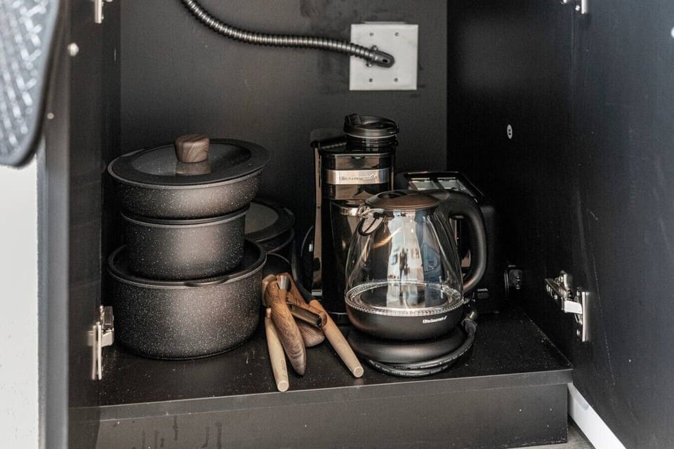 Plates, bowls, mugs, glasses, and utensils—all included