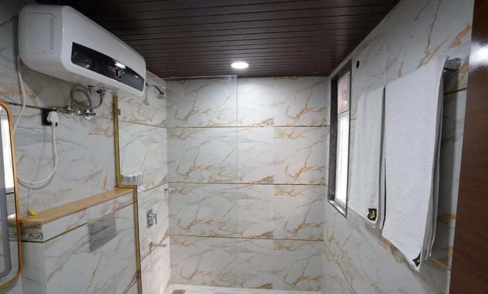 Shower, free toiletries, slippers, towels