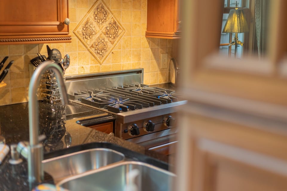 The fully equipped kitchen combines mountain charm with upscale touches, including a premium Viking stove perfect for preparing everything from simple breakfasts to family dinners.