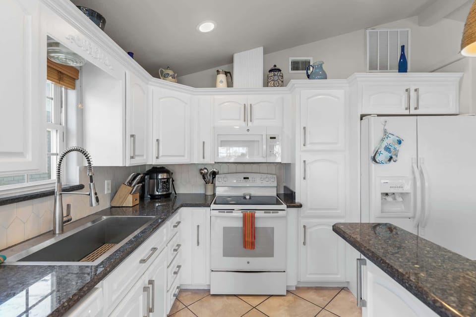 Granite counters and full-size appliances make meals simple
