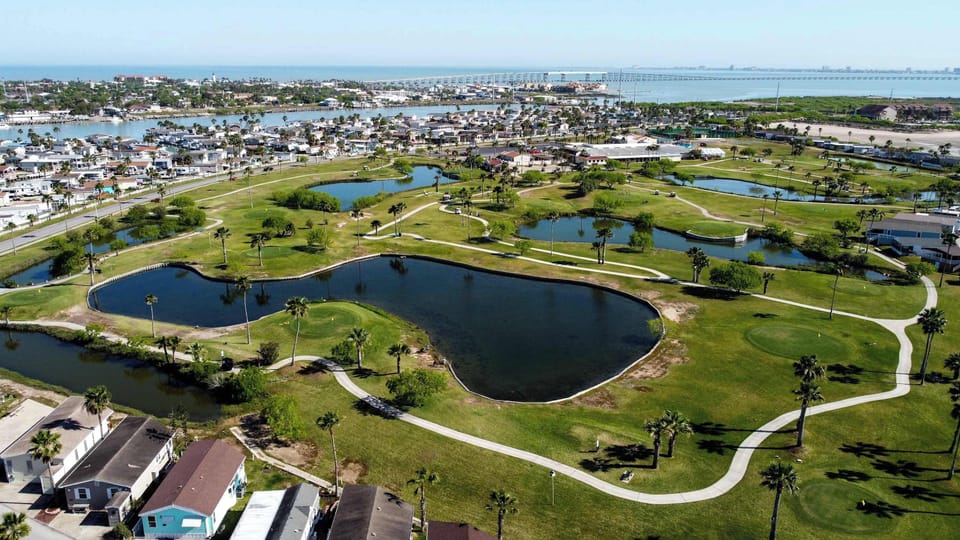 Tee off on the 18-hole course with the island beyond